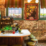 Exposed brick walls by the bar