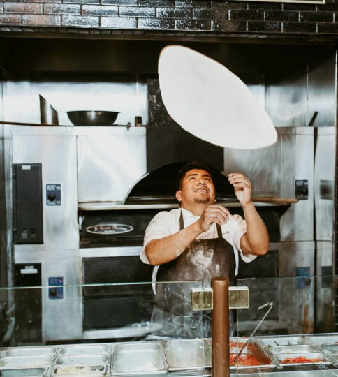 Tossing pizza dough
