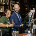 Employees having fun behind the bar