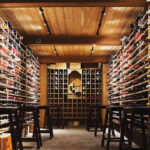 a wine cellar filled with lots of bottles of wine.