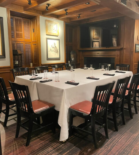 a long table with a white table cloth on it.