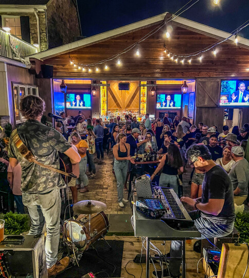 a group of people playing instruments in front of a crowd.